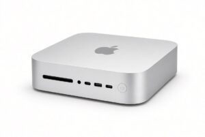 Silver Apple Mac mini with the Apple logo on top, photographed on a white background, used to illustrate the Mac mini RAM apocalypse and higher 2026 prices.