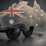 Australia Weighs Smart Glasses Ban in Government Buildings, glasses over flag and map.