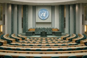 Albanese Urges US-China AI Deal Like Nuclear Treaty, United Nations General Assembly hall.