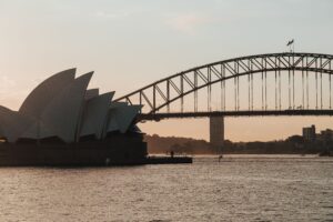 Sydney Opera House and Harbour Bridge at dusk. Queensland data centre water rules are aimed at a demand problem Sydney Water has already flagged on the city’s drinking-water network.