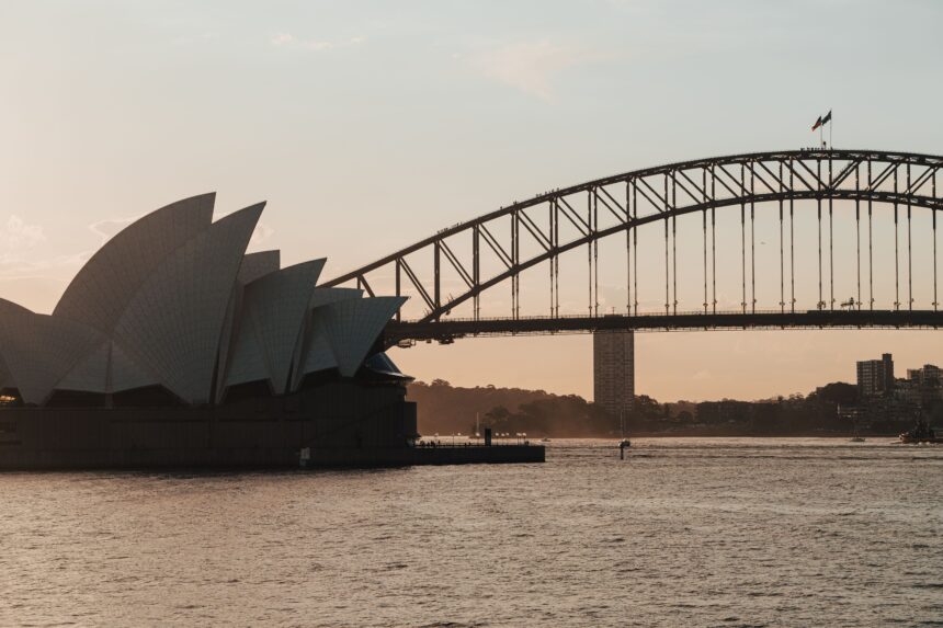 Sydney Opera House and Harbour Bridge at dusk. Queensland data centre water rules are aimed at a demand problem Sydney Water has already flagged on the city’s drinking-water network.